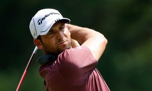 Sergio Garcia of Spain watches his tee shot on the 18th hole dur